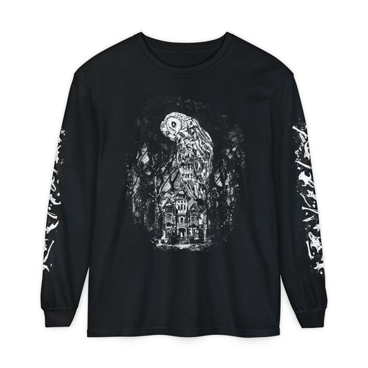 A black long-sleeve t-shirt with a white graphic print of an owl perched on a haunted house with bones on the sleeves